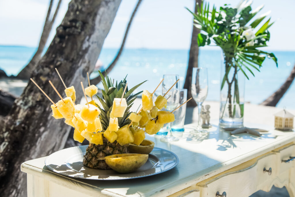tropical fruits on table on beach